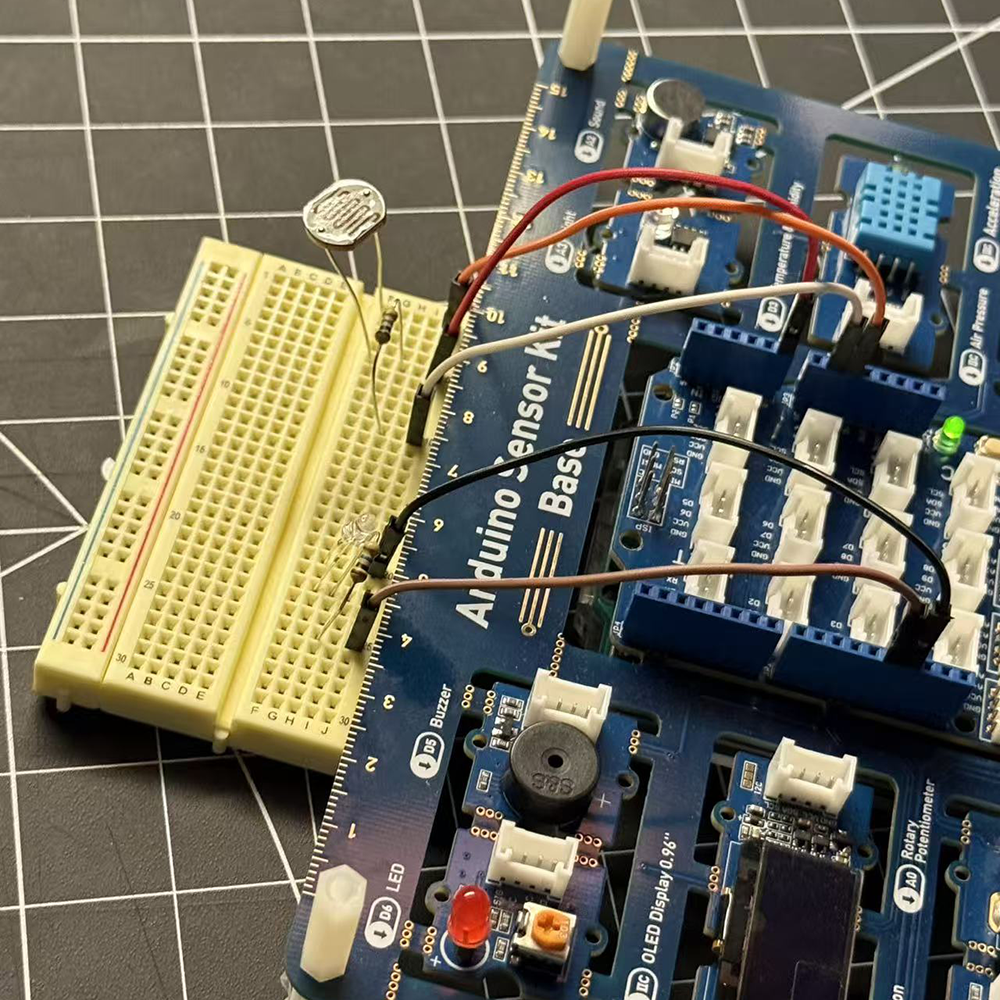 The light sensor should trigger when we cover the light sensor with our hands and turning on LED. However, it did not work when we connected the LED with light sensor and Arduino code, we followed every step through tutorials that we found on YouTube, but it's still not working by the connections.